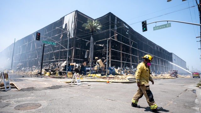 Lineage warehouse fire still buring after 7 days 