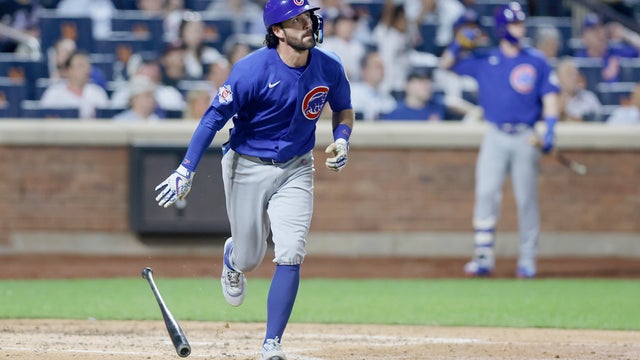 Dansby Swanson #7 of the Chicago Cubs follows through on his sixth inning RBI triple against the New York Mets at Citi Field on June 24, 2026 in New York City. 