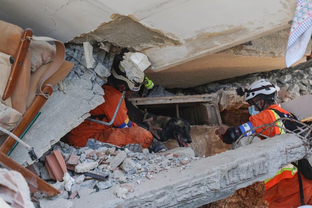 Videos show U.S. rescue team pull mother, baby from rubble in Venezuela
