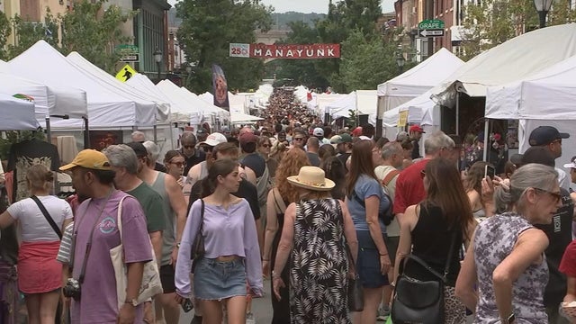 People and tents fill Main Street in Manayunk for an art festival 