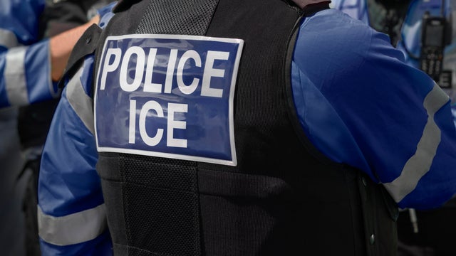 Ice Police agents - Immigration and Customs Enforcement. Close-up of POLICE ICE marking on the back of worn by a trio of DHS police officers at the scene of an incident. 