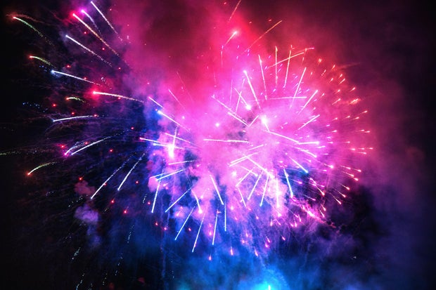 Colorful bright fireworks in the sky during summer festivity in Spain.