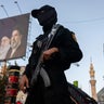 Iranian security forces stand guard in the capital city of Tehran on July 3, 2026, as the country began a week of funeral ceremonies for its former supreme leader, Ayatollah Ali Khamenei. 