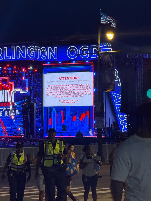 A sign at the Parkway concert asks attendees to evacuate the area because of impending storms 