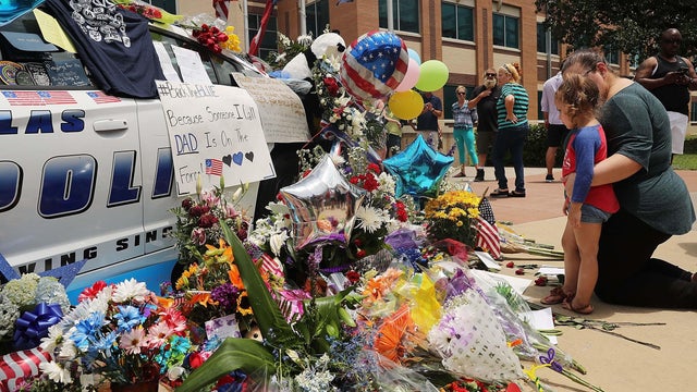 Police officers pay their respects ahead of the funeral for Officer Lorne Ahrens in Plano, Texas, on July 13, 2016. Five officers, including Ahrens, were killed in a shooting incident in Dallas on July 7, 2016. 