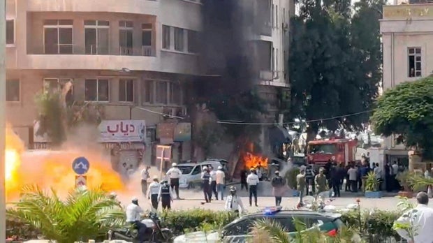 Explosive devices blow up near a hotel where French President Emmanuel Macron was meant to be staying, in Damascus 