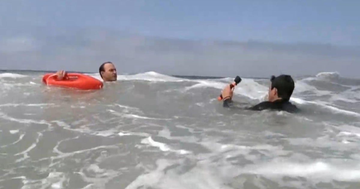 Lifeguards demonstrate how to escape from a rip current