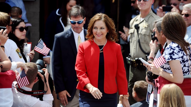 Darline Graham Nordone, sister of Sen. Lindsey Graham, walks to the stage before his announcement for presidency on Monday, June 1, 2015, in Central, South Carolina. 