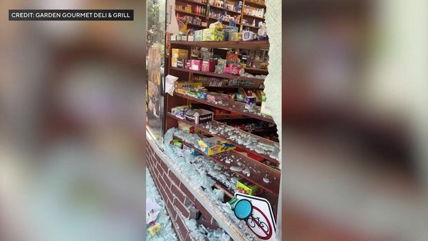 Broken front window of deli