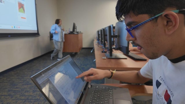 A student works on a laptop during a summer camp at Widener University 