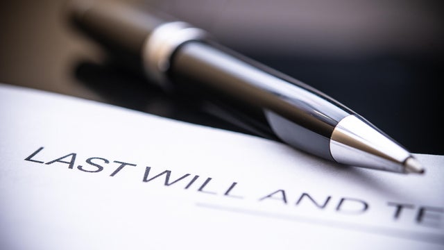 Last Will and Testament Document Close-Up with Elegant Pen on Black Background for Legal and Estate Planning Purposes 