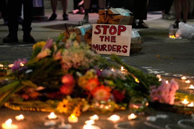 Attendees gather at a candlelight vigil where a Madison police officer shot and killed a man July 22, 2026, in Madison, Wisconsin.