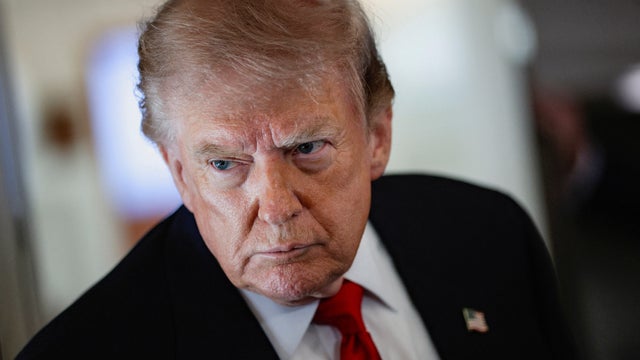 President Trump speaks to reporters aboard Air Force One en route to Michigan, July 27, 2026. 