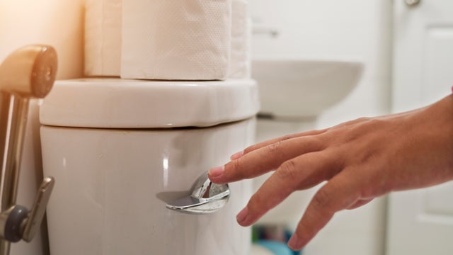 Cropped Hand Of Man Flushing Water 