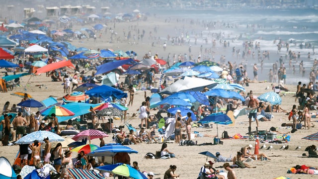 Crowds Flock To SoCal Beaches Amid Heatwave As Hurricane Genevieve Brings Big Surf 