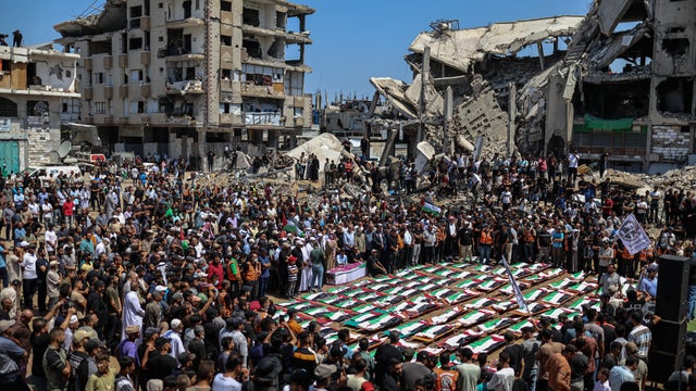 People attend a mass funeral In the Gaza Strip 