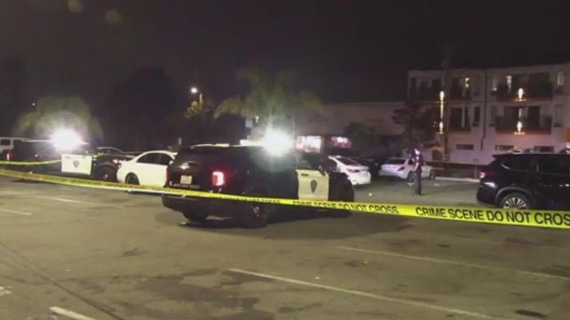 Police at a parking lot near the Santa Cruz Beach Boardwalk 