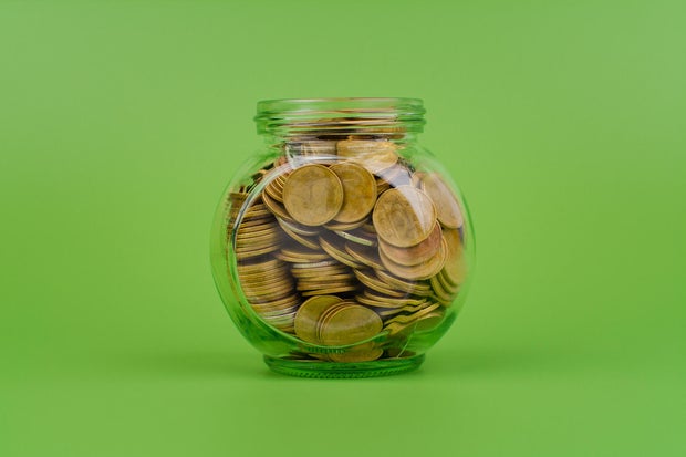 Saving coins in a piggy bank, financial income and financial investment, cash flow from working to earn money