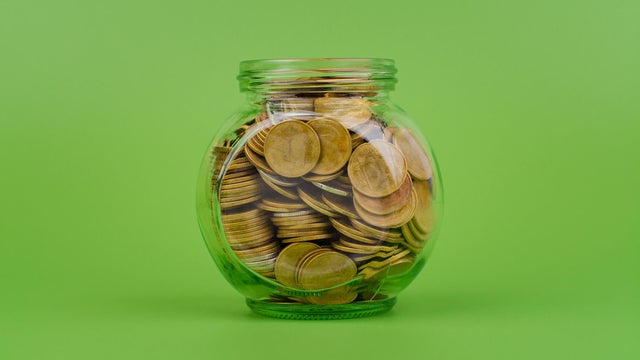 Saving coins in a piggy bank, financial income and financial investment, cash flow from working to earn money 