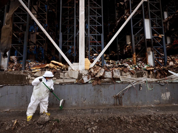 Cleanup in aftermath of the Linage Warehouse fire.