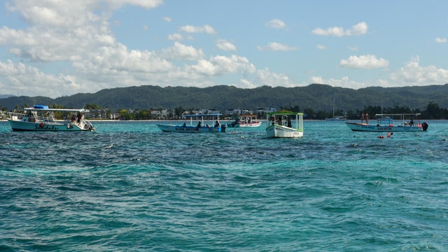 Tourists snorkeling at the island of Booby cay near Nigril on Jamaica 