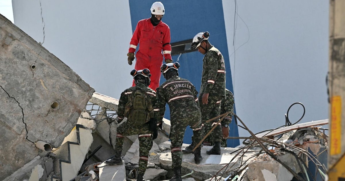 Emergency crews in Colombia desperately search for earthquake survivors