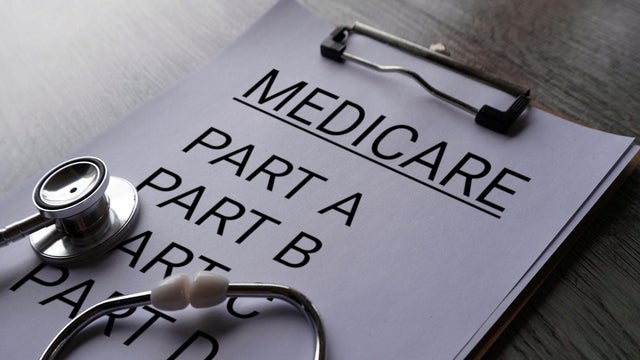 Close up image of stethoscope and paper clipboard with text MEDICARE and part list. 