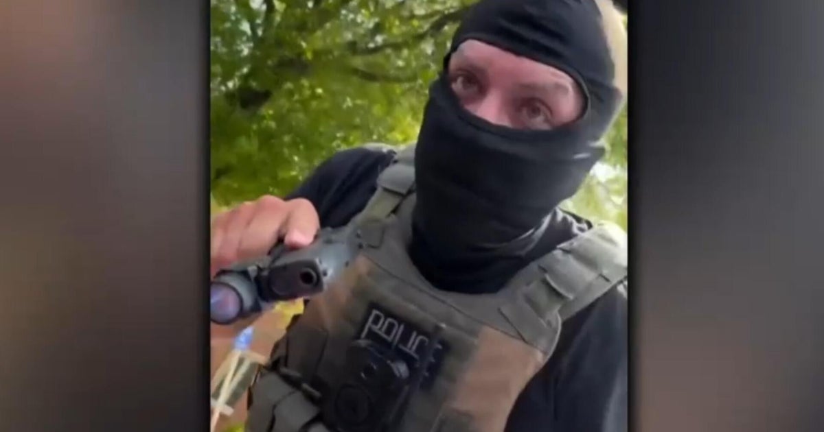 DHS defends agent who pointed gun at woman but hasn't provided proof on claims against her