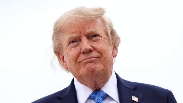 President Trump stops to speak to reporters before boarding Air Force One on Aug. 14, 2026, at Joint Base Andrews in Maryland. 