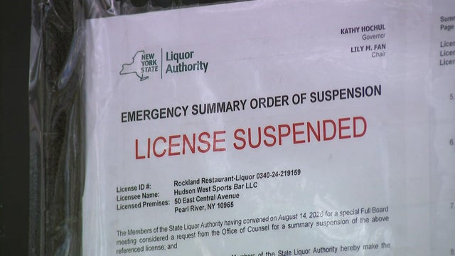 A woman holding car keys in her hand reaches for a glass of vodka, alcoholic beverage driving license 