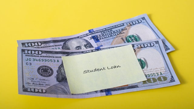 'Student Loan' note posted to two one hundred dollar bills 