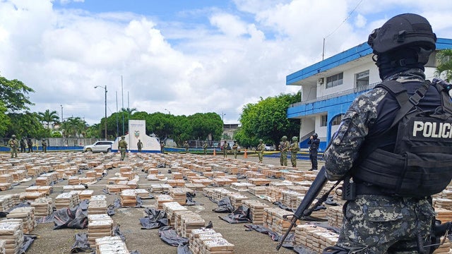 Police and soldiers present 22 tons of drugs that were seized after an operation in Quevedo, Ecuador, on Jan. 22, 2024. 