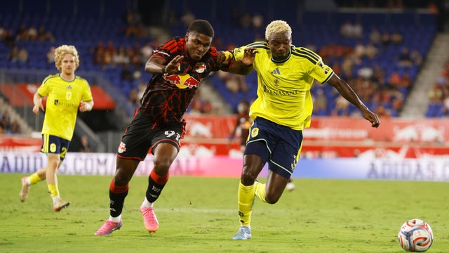 Mijahir Jim&eacute;nez #91 of the Red Bull New York and Maxwell Woledzi #3 of the Nashville SC challenge for the ball during the second half at Sports Illustrated Stadium on August 19, 2026 in Harrison, New Jersey. 