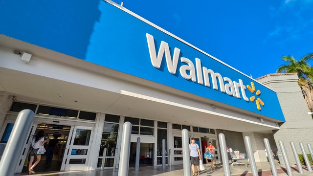 Exterior of a Walmart Supercenter on a Bright Day with Customers 
