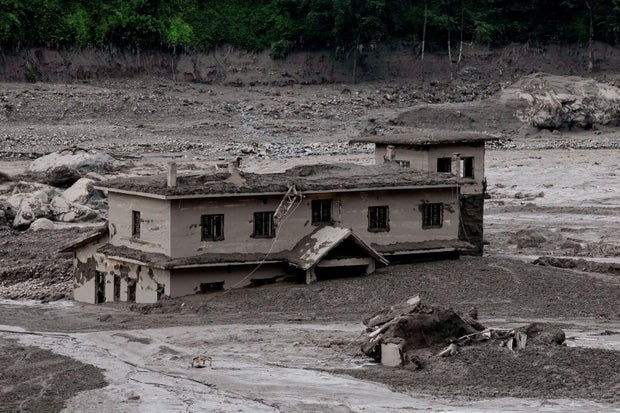 Mud covers a property following flash flooding in Trishuli in Nepal's Nuwakot district Aug. 26, 2026. 