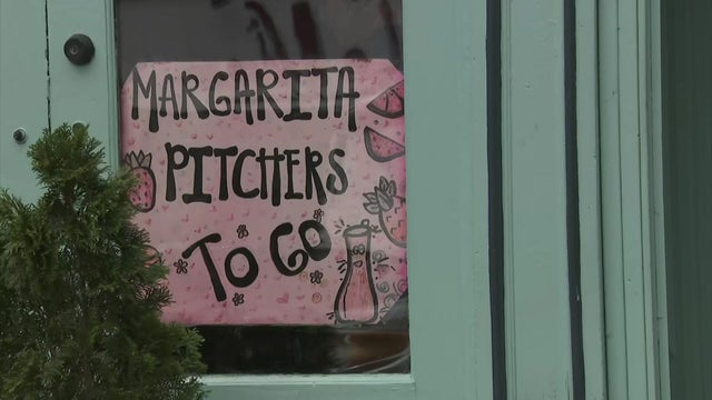"Margarita pitchers to go" sign 