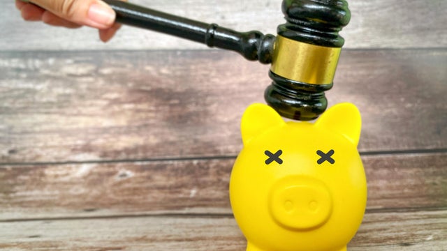 Legal Financial Enforcement Concept with Gavel and Piggy Bank 