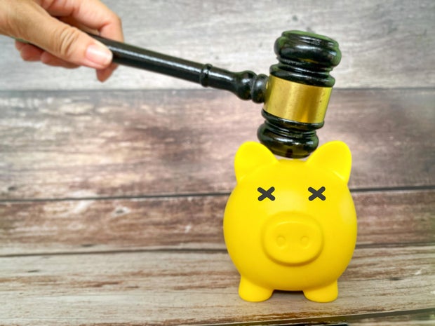 Legal Financial Enforcement Concept with Gavel and Piggy Bank