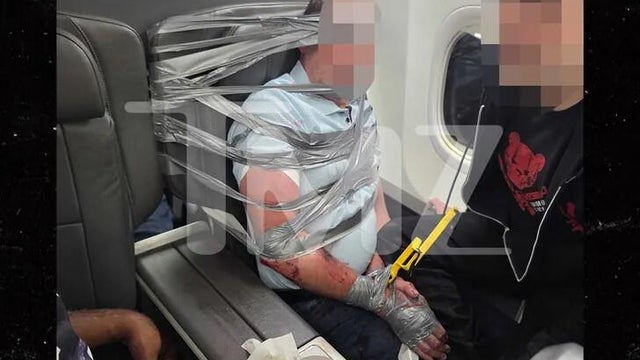 tmz-american-airlines-passenger-restrained.jpg 