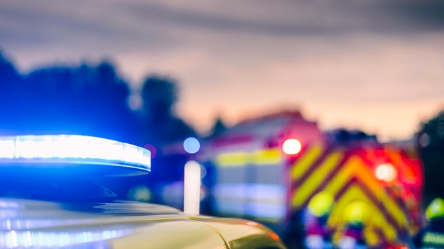 Blue flashing light on ambulance car while responding at traffic accident 