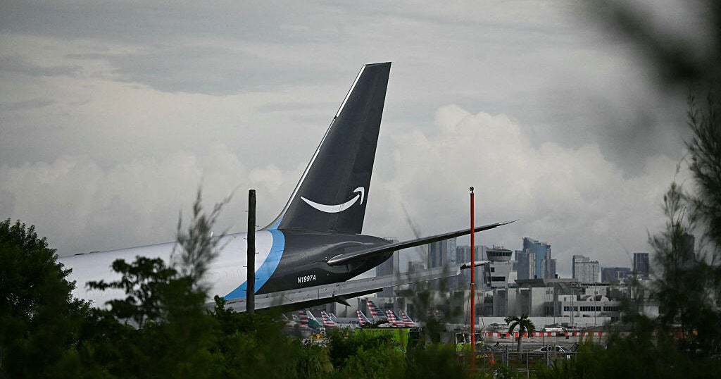 Amazon cargo plane overruns runway at Miami International Airport, hits several vehicles, officials say