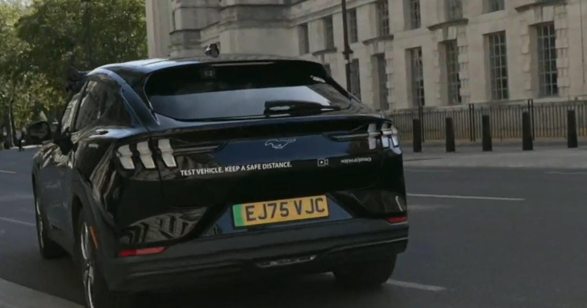 Watch: CBS News reporter tests out autonomous, AI-powered Uber in London