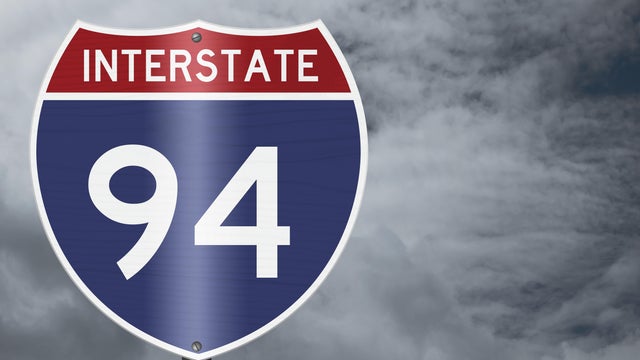 American Interstate I94 sign with stormy sky for transportation 
