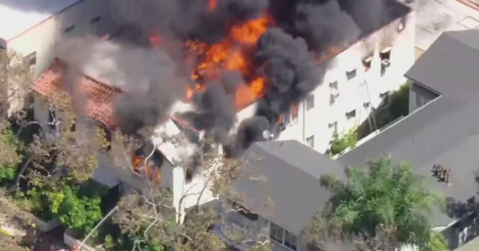 Fire tears through apartment building in Beverly Hills; 2 firefighters transported to hospital