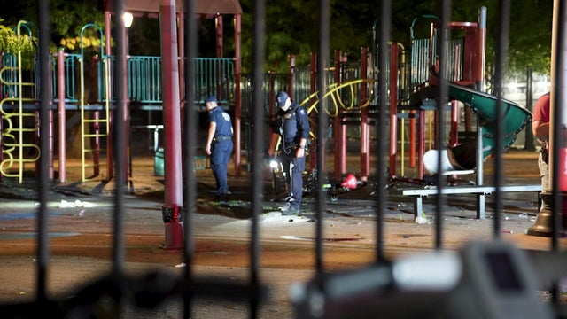 NYPD officers searching playground 