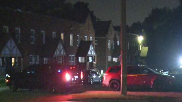 Flashing Lights and Police Tape Reading "Police Line Do Not Cross" 