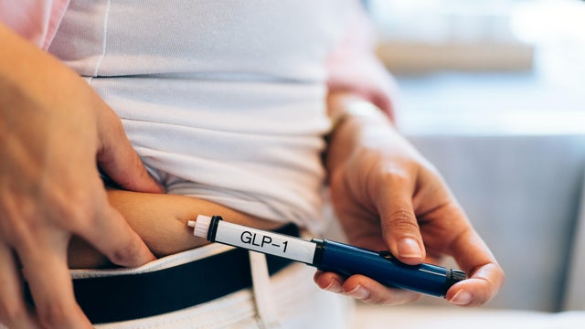 Young Woman Using Peptides Injection at Home 