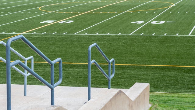 view of 50 yard line of high school football field from the stands 