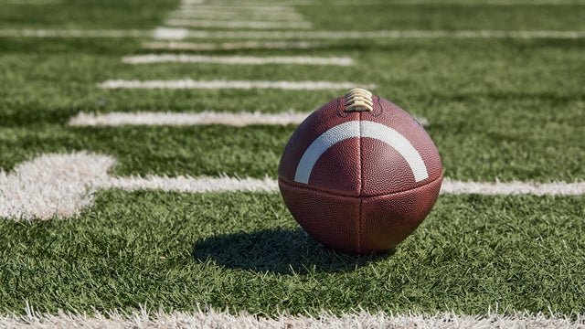 American football on playing field 