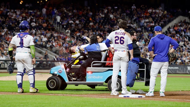 New York Mets first baseman Jared Young is brought off the field on a stretcher after colliding with pitcher Nolan McLean during the sixth inning of a baseball game against the Philadelphia Phillies, Thursday, Sept. 17, 2026, in New York. 
